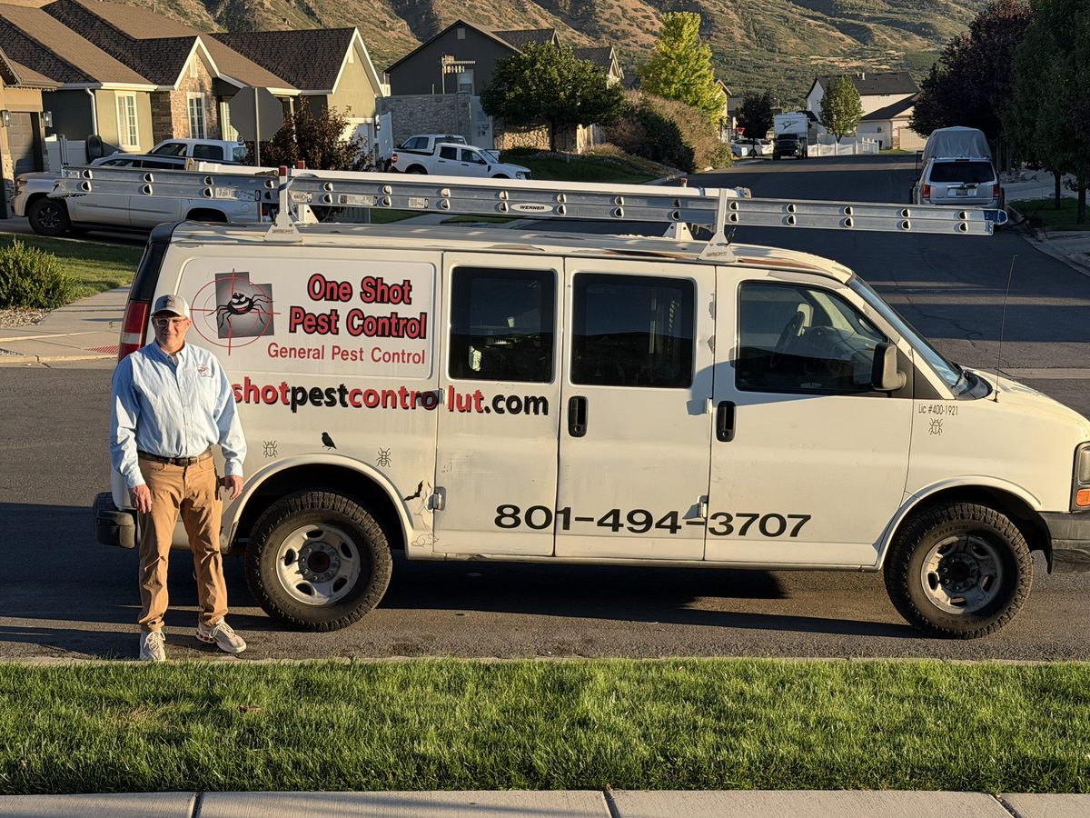 One Shot Pest Control owner standing beside the company service van in Payson, Utah